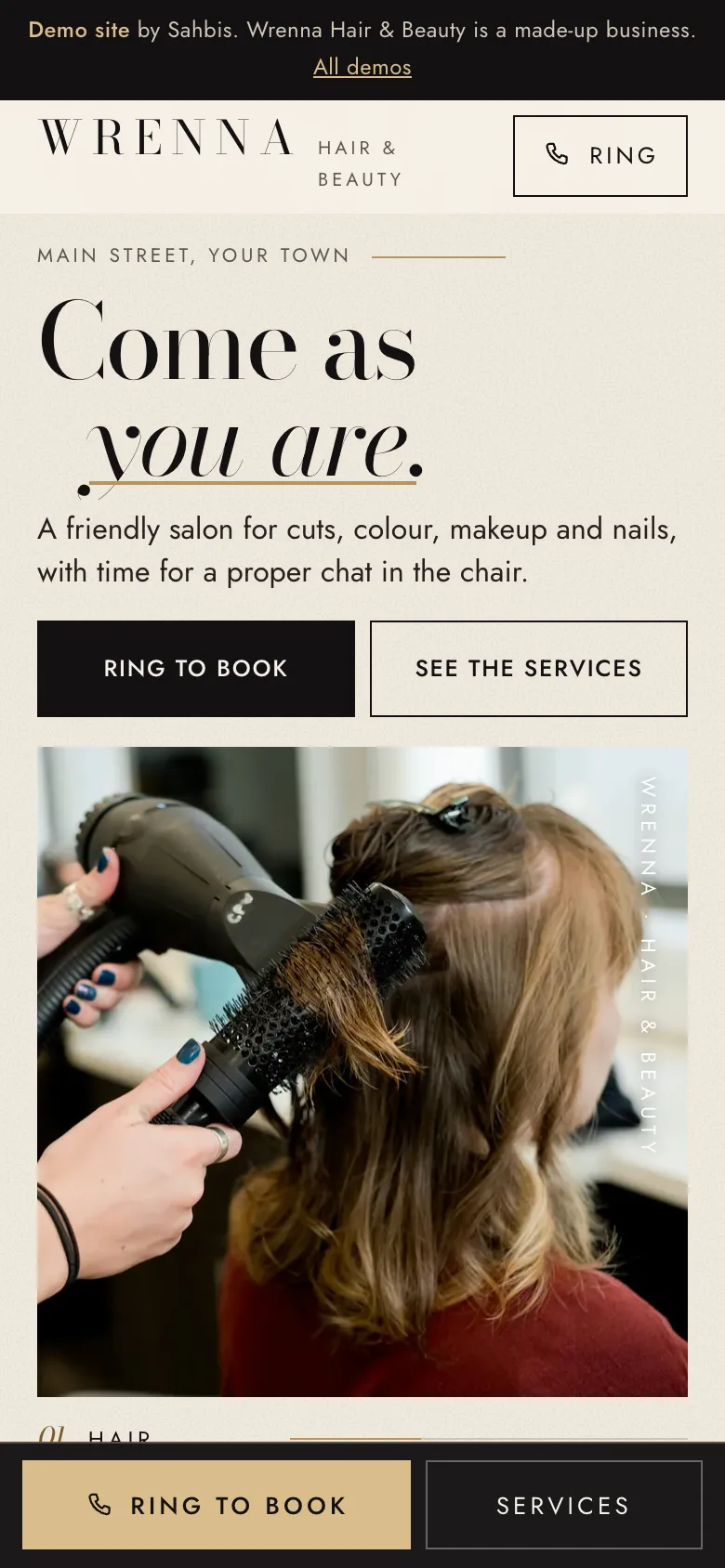 The home page of the Wrenna Hair & Beauty demo site on a phone. Wrenna Hair & Beauty is a made-up hair salon.